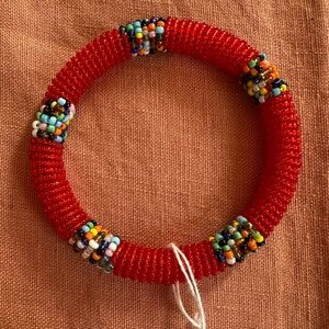 Red Beaded Bracelet with Decorative Accents